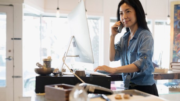 A woman is on the phone; image used for HSBC Malaysia Amanah telebanking